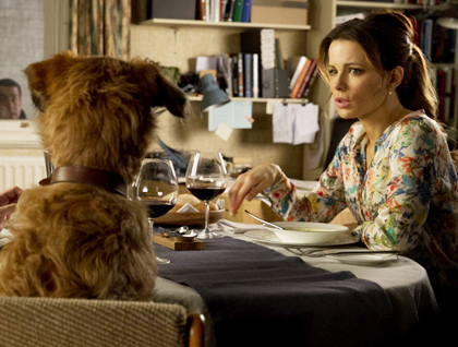 Kate Beckinsale talking to a dog.