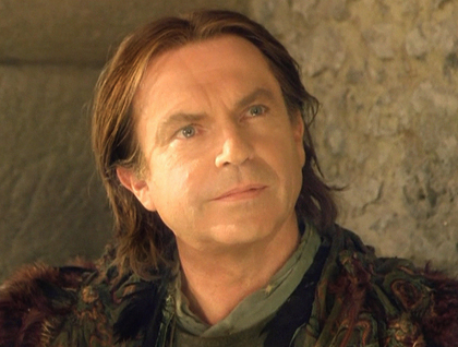 Sam Neill as Merlin.